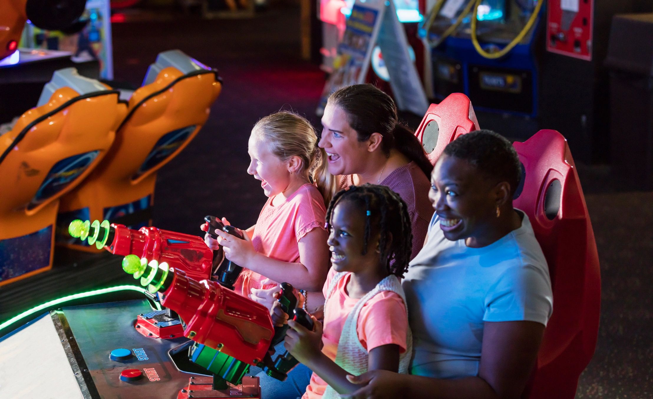 Guests enjoying an interactive arcade-style experience at an event