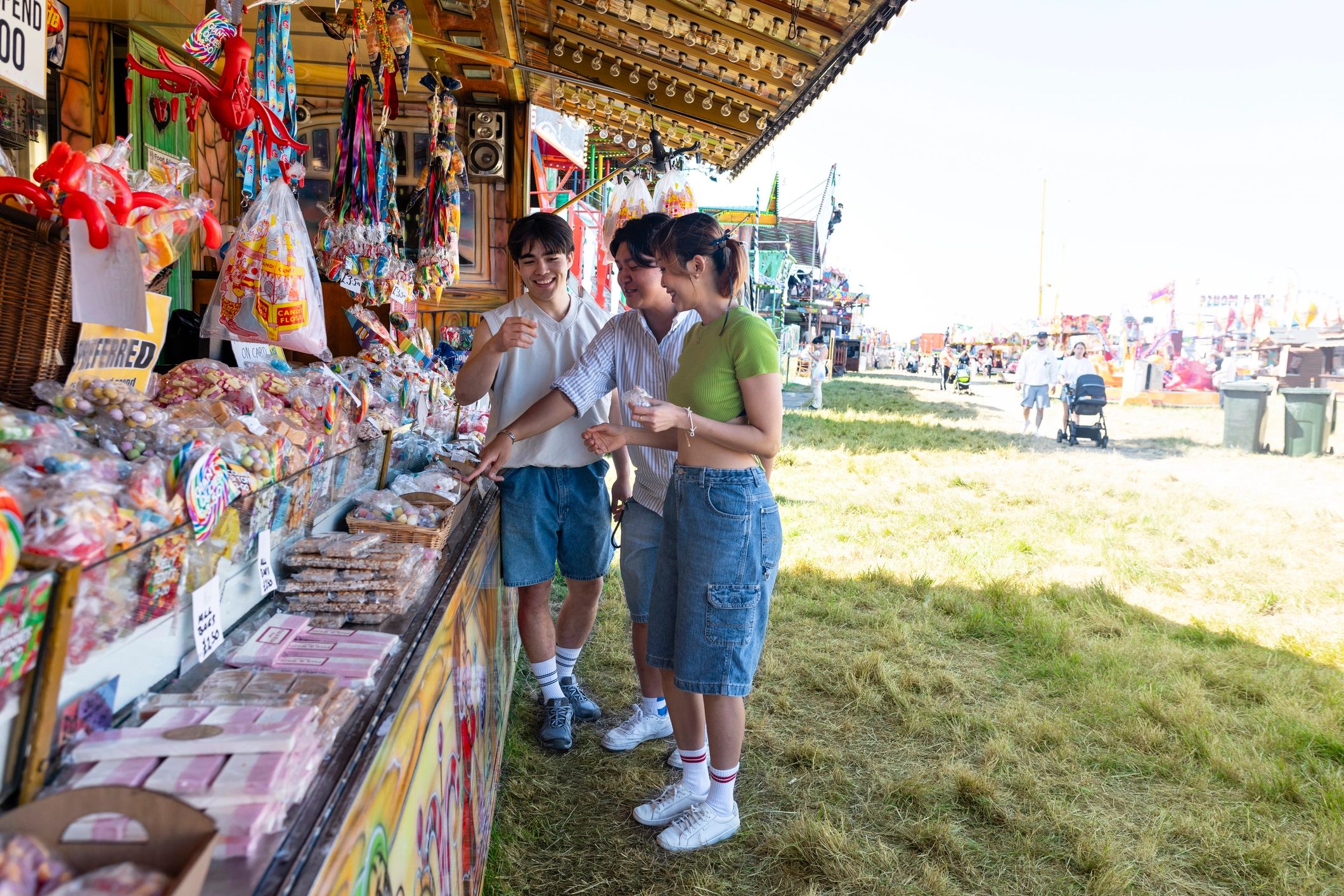 Friends interacting at a lively branded booth