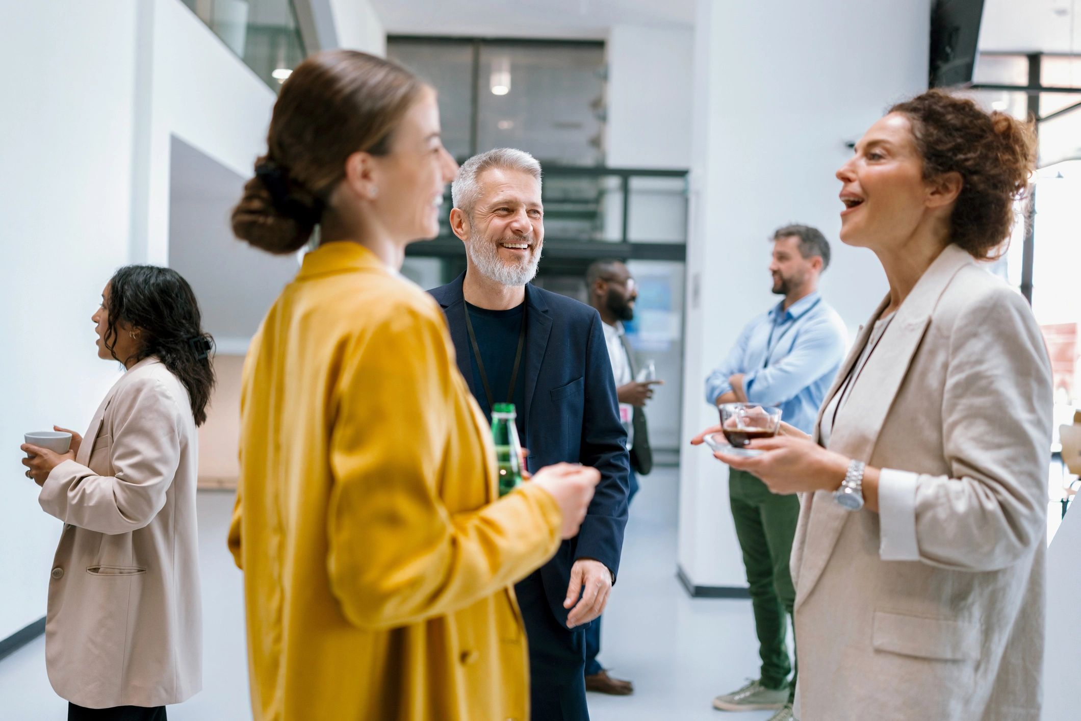 Business people enjoying conversation during a conference break